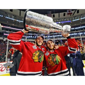 Patrick Kane & Jonathan Toews Chicago Blackhawks Unsigned 2015 Stanley Cup Champions Raising Cup Photograph